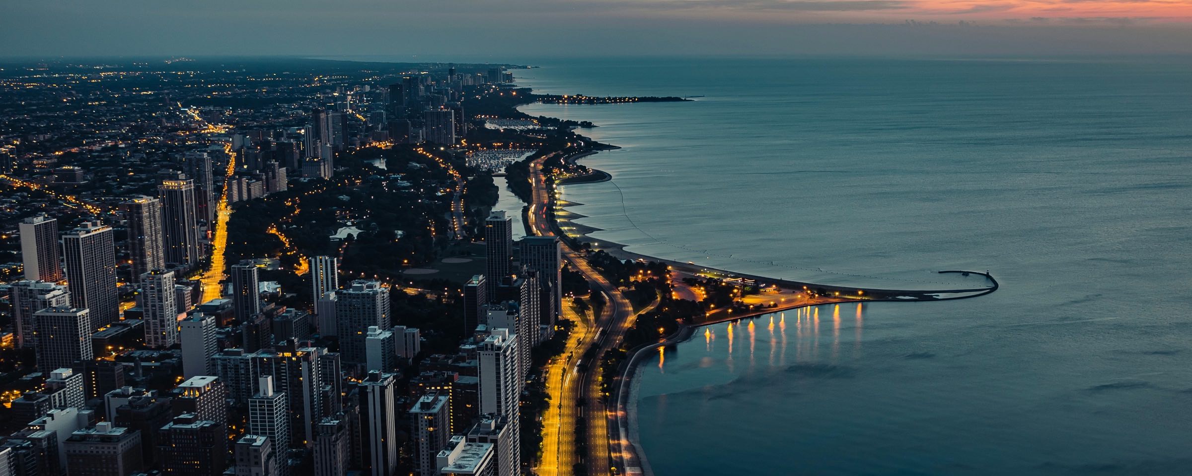 Chicago skyline along Lake Michigan at golden hour